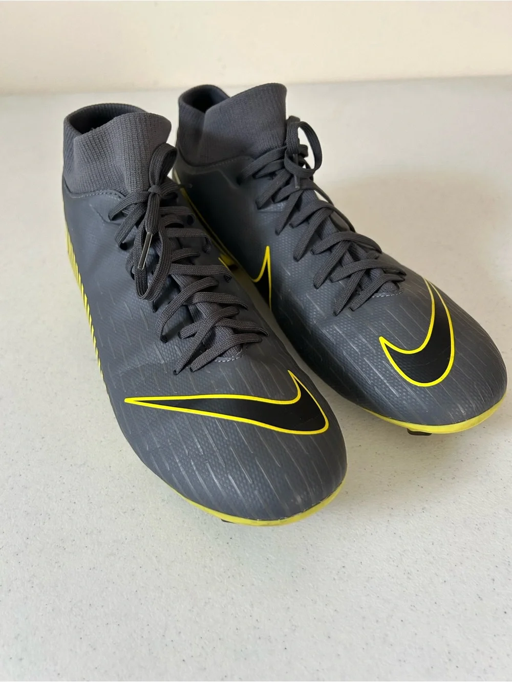 Nike Men’s Black Soccer Cleats with Yellow Swoosh